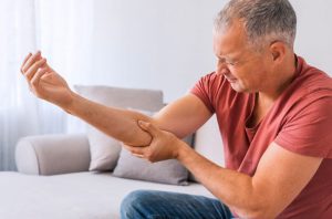 A person suffering from elbow pain